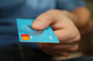 a person holding a credit card